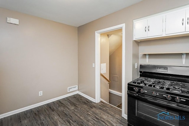 1831 Evansdale Ave, Toledo, OH 43607 - kitchen with black range with gas cooktop, dark wood finished floors, white cabinetry, and open shelves