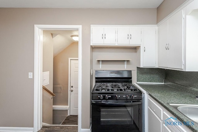 1831 Evansdale Ave, Toledo, OH 43607 - kitchen featuring black gas range, white cabinetry, wood finished floors, and dark countertops