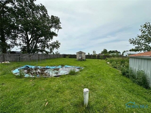 10889 Nelson Rd, Bowling Green, OH 43402 - fenced backyard featuring a storage shed