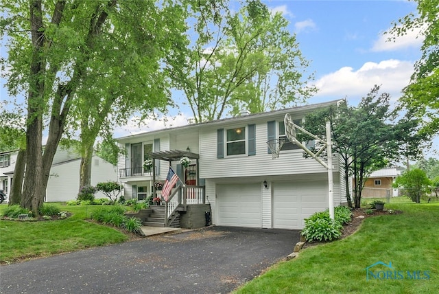 6961 Convent Blvd, Sylvania, OH 43560 - bi-level home with driveway and an attached garage