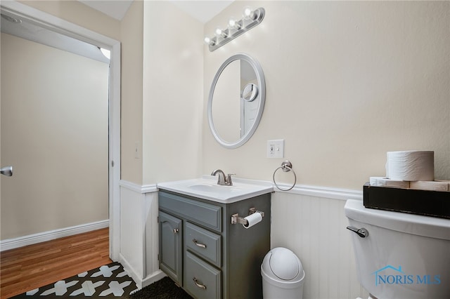 6961 Convent Blvd, Sylvania, OH 43560 - bathroom with vanity, wainscoting, and wood finished floors