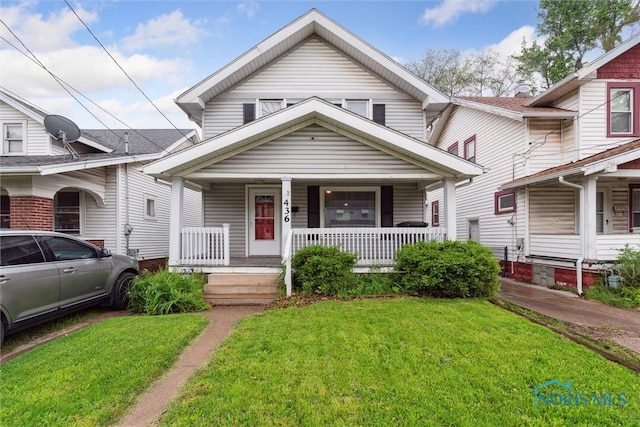 436 Danberry St, Toledo, OH 43609 - view of front of property with a porch and a front yard