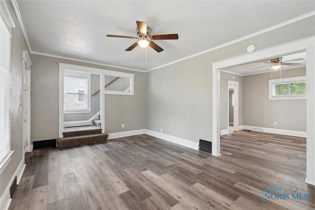 436 Danberry St, Toledo, OH 43609 - unfurnished living room featuring ceiling fan, stairway, wood finished floors, and ornamental molding