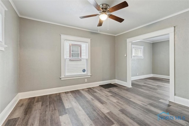 436 Danberry St, Toledo, OH 43609 - empty room featuring wood finished floors, ceiling fan, and ornamental molding