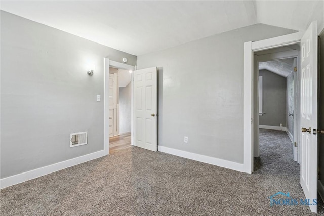 436 Danberry St, Toledo, OH 43609 - unfurnished bedroom featuring carpet floors and vaulted ceiling