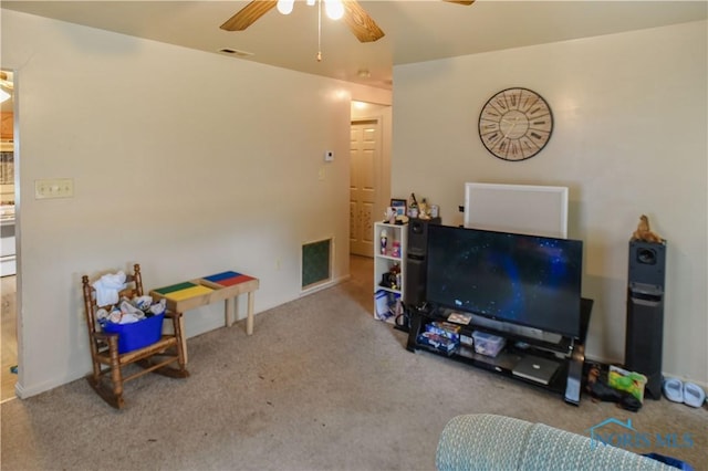 912 Virginia St, Port Clinton, OH 43452 - carpeted living room with a ceiling fan