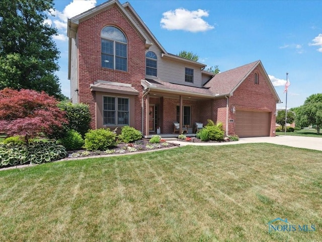 646 Whisperlake Rd, Holland, OH 43528 - traditional-style house featuring brick siding, concrete driveway, a front yard, an attached garage, and covered porch