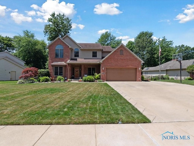 646 Whisperlake Rd, Holland, OH 43528 - traditional-style house featuring brick siding, driveway, an attached garage, and a front lawn