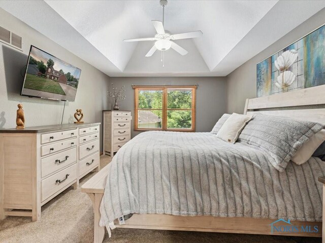 646 Whisperlake Rd, Holland, OH 43528 - carpeted bedroom featuring lofted ceiling, a tray ceiling, and a ceiling fan