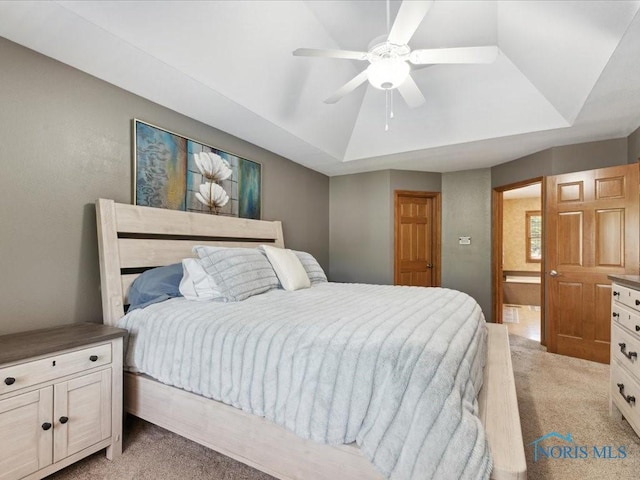 646 Whisperlake Rd, Holland, OH 43528 - bedroom with light carpet, a tray ceiling, and ceiling fan
