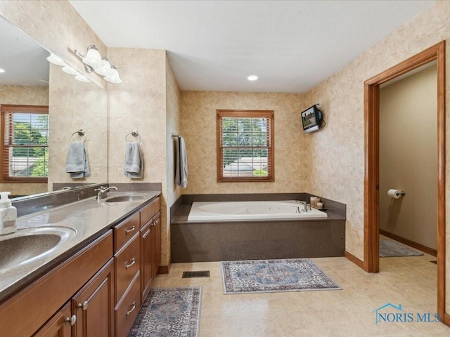 646 Whisperlake Rd, Holland, OH 43528 - bathroom featuring double vanity and a garden tub