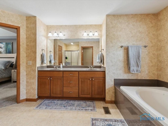 646 Whisperlake Rd, Holland, OH 43528 - ensuite bathroom featuring double vanity, a garden tub, a shower stall, and tile patterned flooring