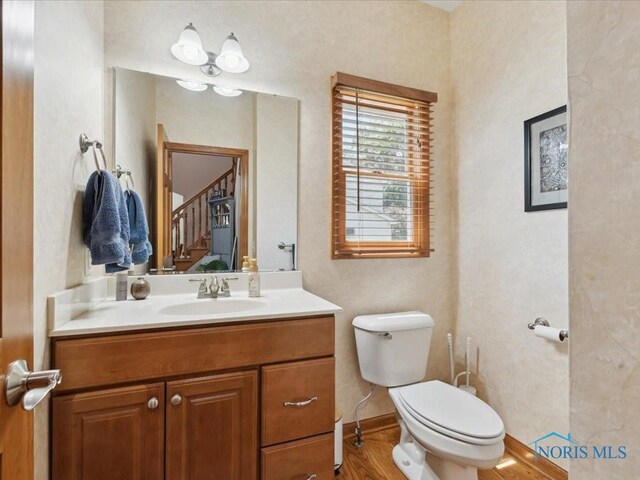 646 Whisperlake Rd, Holland, OH 43528 - bathroom featuring vanity and wood finished floors