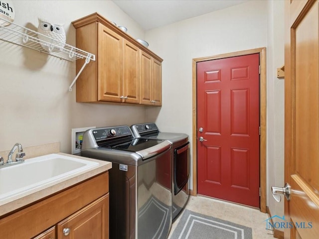 646 Whisperlake Rd, Holland, OH 43528 - washroom featuring independent washer and dryer and cabinet space