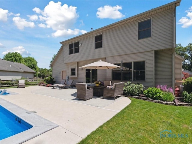 646 Whisperlake Rd, Holland, OH 43528 - back of house with a patio, a yard, an outdoor pool, and an outdoor living space