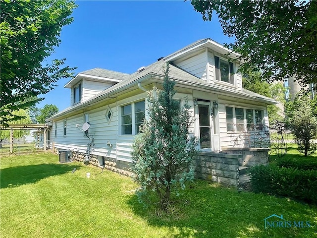 107 N Maple St, Payne, OH 45880 - view of property exterior with a yard and a central air condition unit