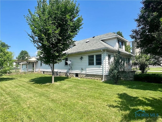107 N Maple St, Payne, OH 45880 - back of house featuring a yard and a shingled roof
