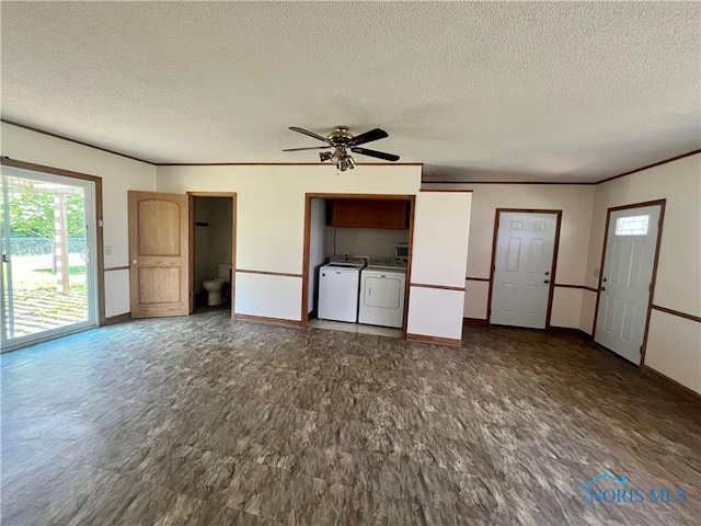 107 N Maple St, Payne, OH 45880 - unfurnished living room featuring healthy amount of natural light, a textured ceiling, washer and clothes dryer, a ceiling fan, and ornamental molding