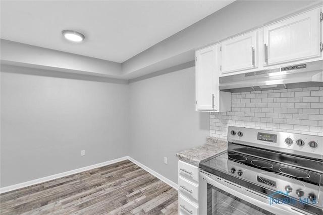 1845 Newport Ave, Toledo, OH 43613 - kitchen featuring electric range, under cabinet range hood, and white cabinets