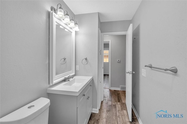 1845 Newport Ave, Toledo, OH 43613 - half bath with vanity and wood finished floors