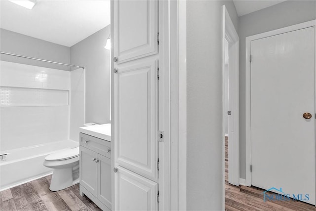 1845 Newport Ave, Toledo, OH 43613 - bathroom featuring wood finished floors, vanity, and shower / washtub combination
