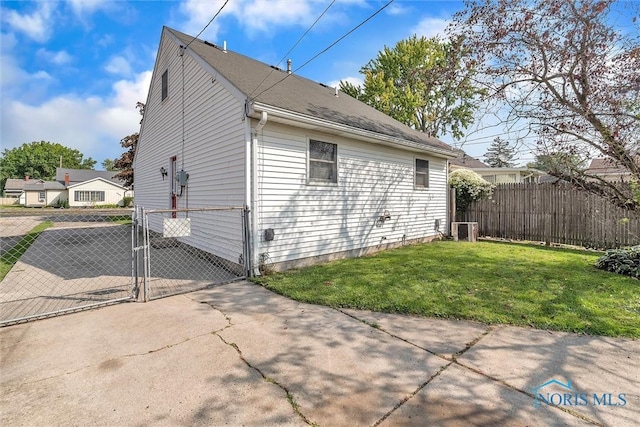 1845 Newport Ave, Toledo, OH 43613 - view of property exterior with a gate and a central AC unit