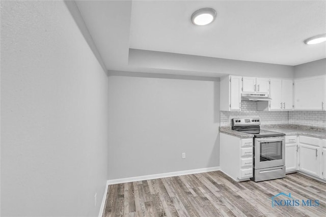 1845 Newport Ave, Toledo, OH 43613 - kitchen with stainless steel electric range, under cabinet range hood, white cabinets, light wood-style floors, and light countertops