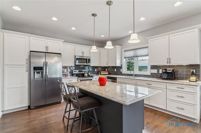 3525 Magnolia Dr, Findlay, OH 45840 - kitchen with appliances with stainless steel finishes, white cabinets, backsplash, and recessed lighting