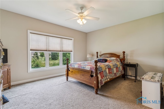 3525 Magnolia Dr, Findlay, OH 45840 - carpeted bedroom with baseboards and ceiling fan