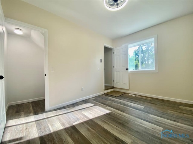 5240 Rambo Ln, Toledo, OH 43623 - unfurnished bedroom featuring wood finished floors and baseboards