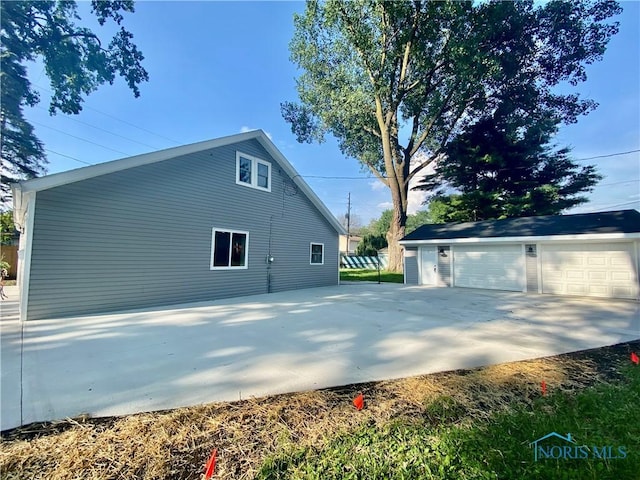 5240 Rambo Ln, Toledo, OH 43623 - view of side of property with a garage and an outdoor structure