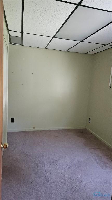 49 N Norden Rd, Oregon, OH 43616 - carpeted empty room with a drop ceiling