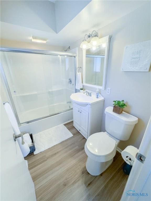 2148 Richards Rd Unit 6, Toledo, OH 43606 - bathroom featuring vanity, wood finished floors, and bath / shower combo with glass door