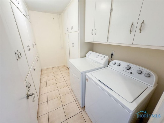 2148 Richards Rd Unit 6, Toledo, OH 43606 - laundry room with washer and clothes dryer, light tile patterned floors, and cabinet space