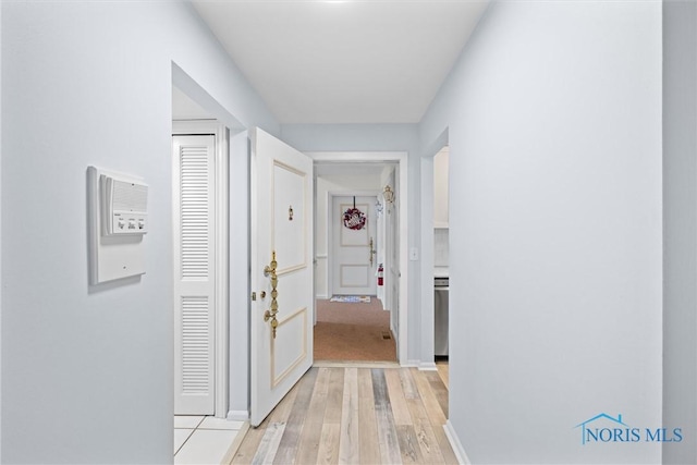5679 Monroe St Unit 118, Sylvania, OH 43560 - hallway with light wood-style floors and baseboards