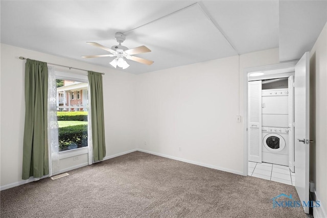 5679 Monroe St Unit 118, Sylvania, OH 43560 - unfurnished room featuring stacked washer / dryer, carpet flooring, and a ceiling fan