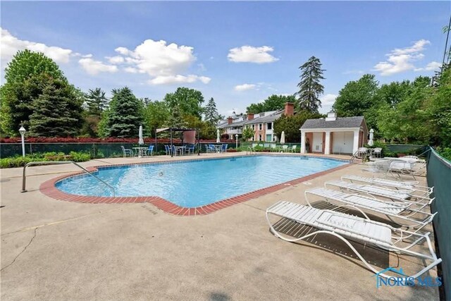 5679 Monroe St Unit 118, Sylvania, OH 43560 - community pool featuring a patio