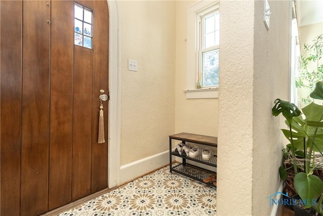 2448 Orchard Rd, Ottawa Hills, OH 43606 - foyer featuring a textured wall and tile patterned floors