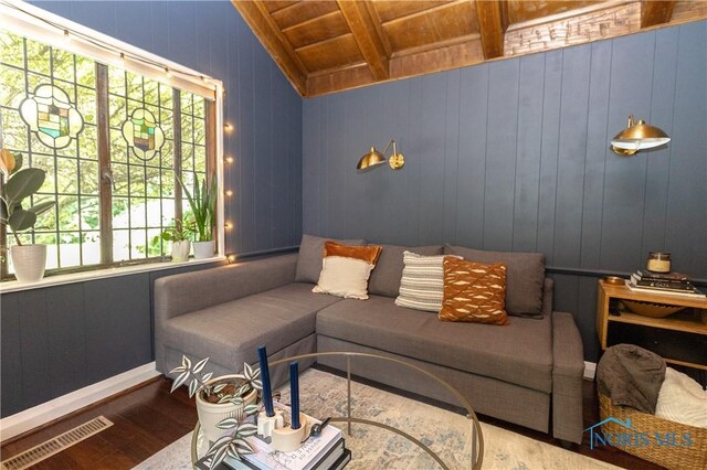 2448 Orchard Rd, Ottawa Hills, OH 43606 - living room with a wood ceiling with exposed beams, wood finished floors, and wooden walls
