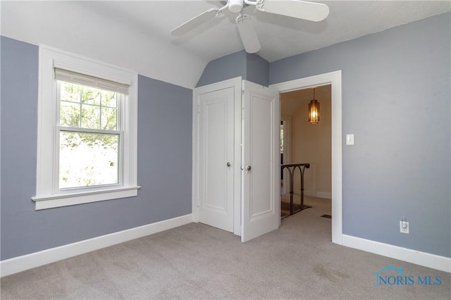 2448 Orchard Rd, Ottawa Hills, OH 43606 - unfurnished bedroom with vaulted ceiling, light carpet, and ceiling fan