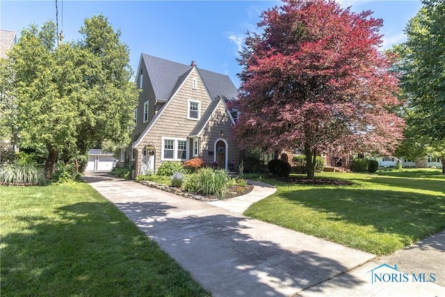 2448 Orchard Rd, Ottawa Hills, OH 43606 - view of front of property with a front lawn and an outdoor structure
