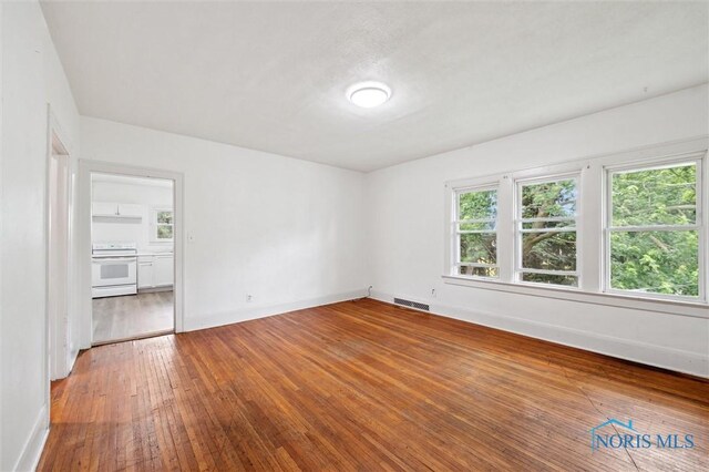 3042 Schneider Rd, Toledo, OH 43614 - unfurnished room with hardwood / wood-style floors and baseboards
