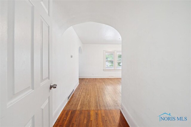 3042 Schneider Rd, Toledo, OH 43614 - corridor with arched walkways and hardwood / wood-style flooring