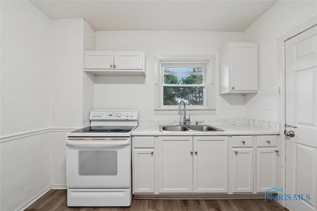 3042 Schneider Rd, Toledo, OH 43614 - kitchen featuring white range with electric cooktop, white cabinetry, dark wood-style flooring, and light countertops