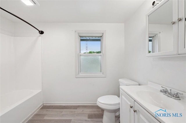 3042 Schneider Rd, Toledo, OH 43614 - bathroom with vanity, wood finished floors, and shower / bathtub combination