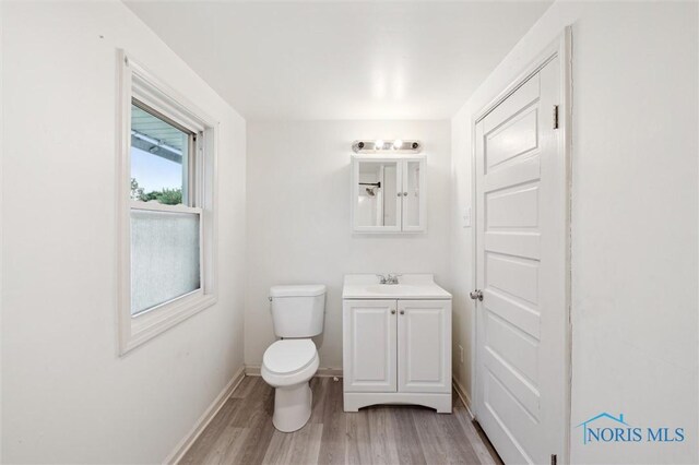 3042 Schneider Rd, Toledo, OH 43614 - bathroom with vanity and wood finished floors
