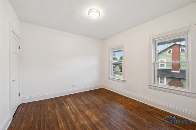 3042 Schneider Rd, Toledo, OH 43614 - unfurnished room with dark wood finished floors and baseboards
