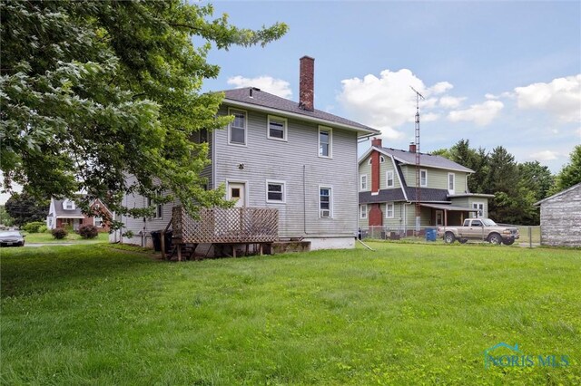 3042 Schneider Rd, Toledo, OH 43614 - back of property featuring a chimney and a yard