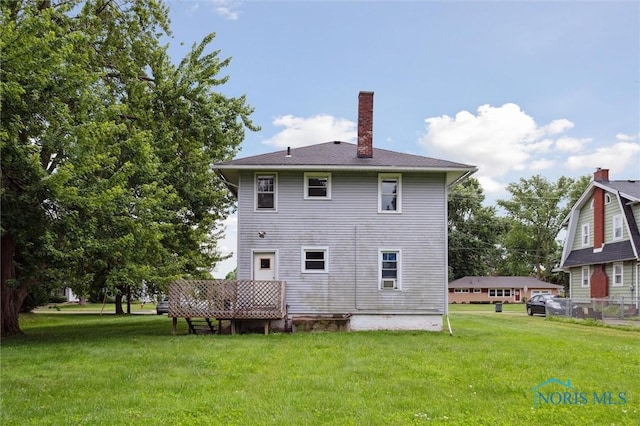3042 Schneider Rd, Toledo, OH 43614 - rear view of property with a chimney and a yard