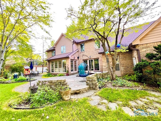 2720 Derby Rd, Ottawa Hills, OH 43615 - back of property with a patio and brick siding